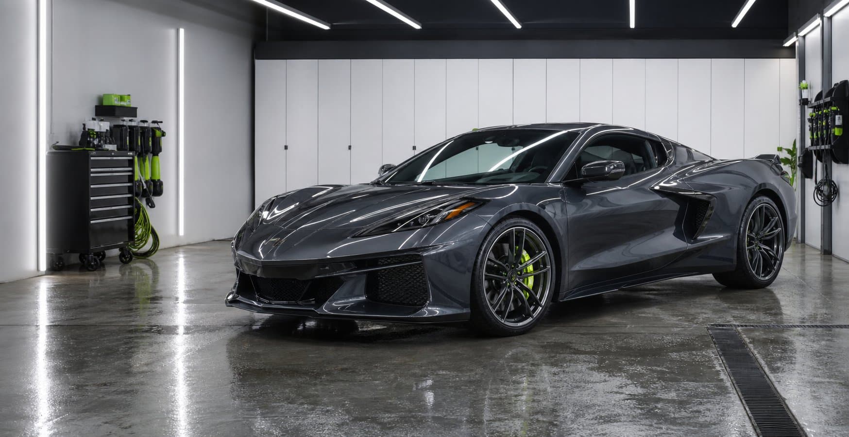Graphite exotic coupe inside a precision detailing studio